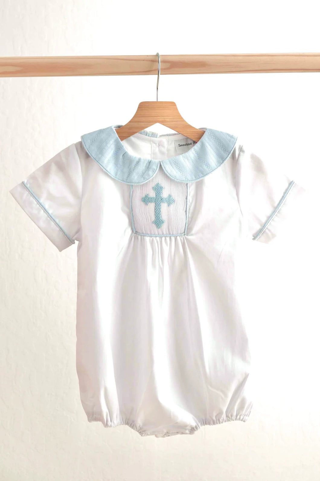 Blue smocked crosses on White Bubble